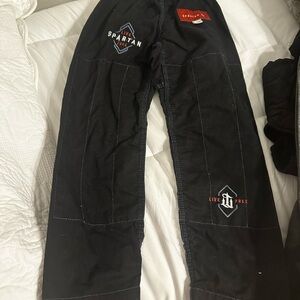 Kids size small Gi with pants for jiu jitsu. Spartan call of duty edition